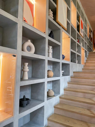 Under-stair storage solution featuring custom drawers and hidden compartments in a modern living room.