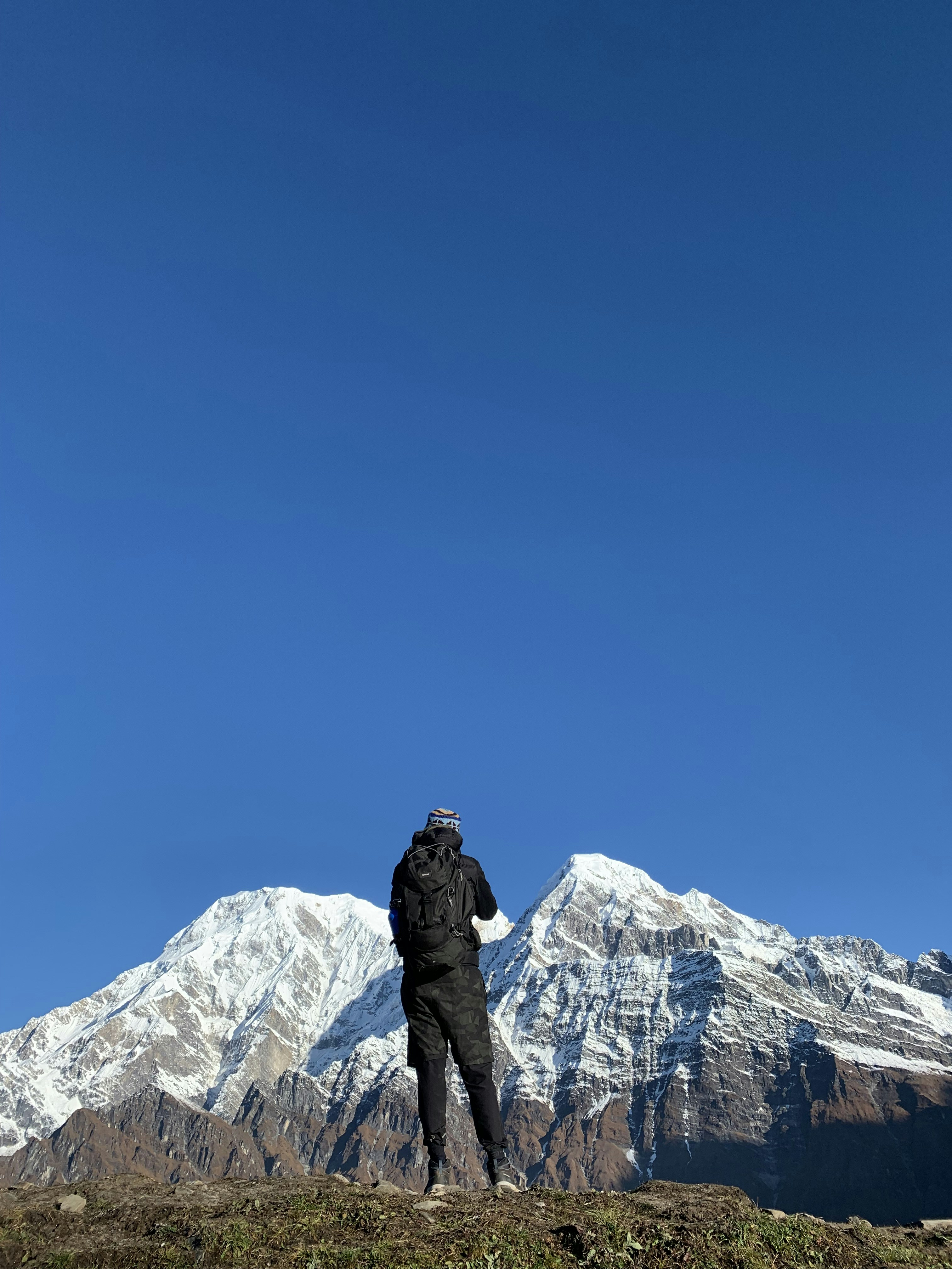 a person standing on a mountain