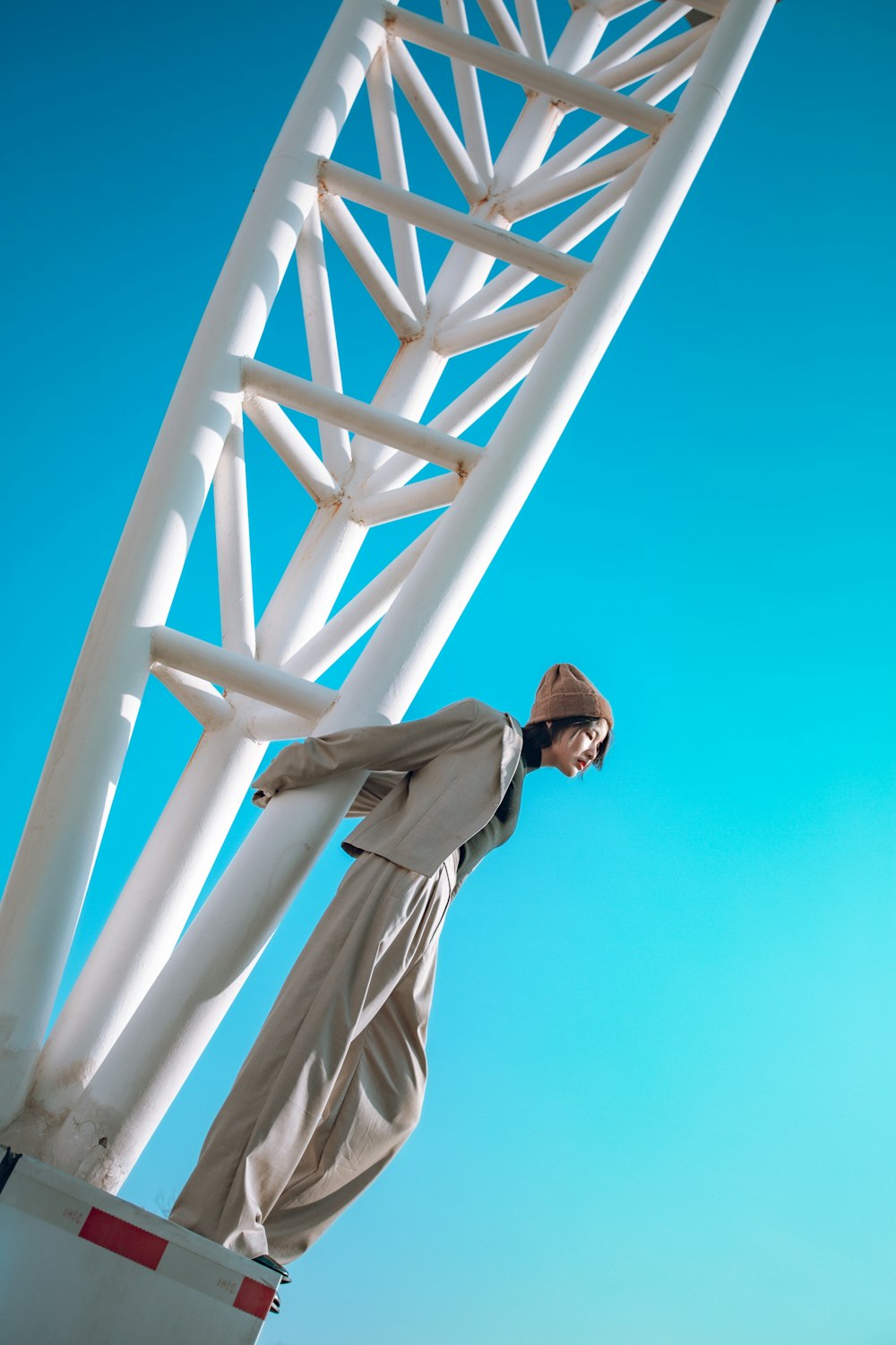 a person standing on a white tower