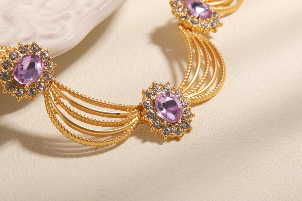 a gold and purple bracelet