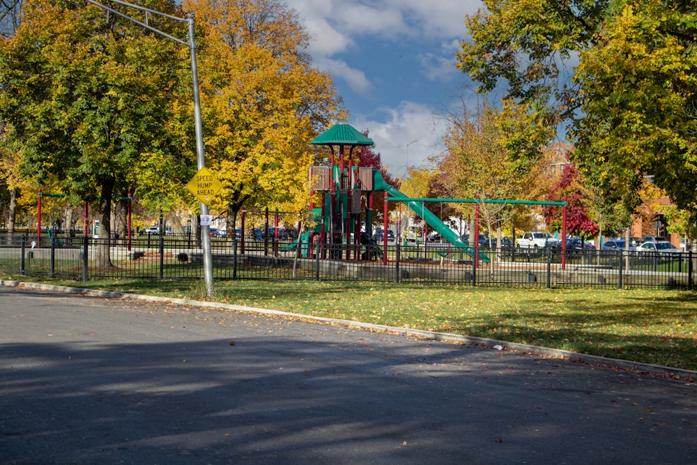 a playground with trees and grass