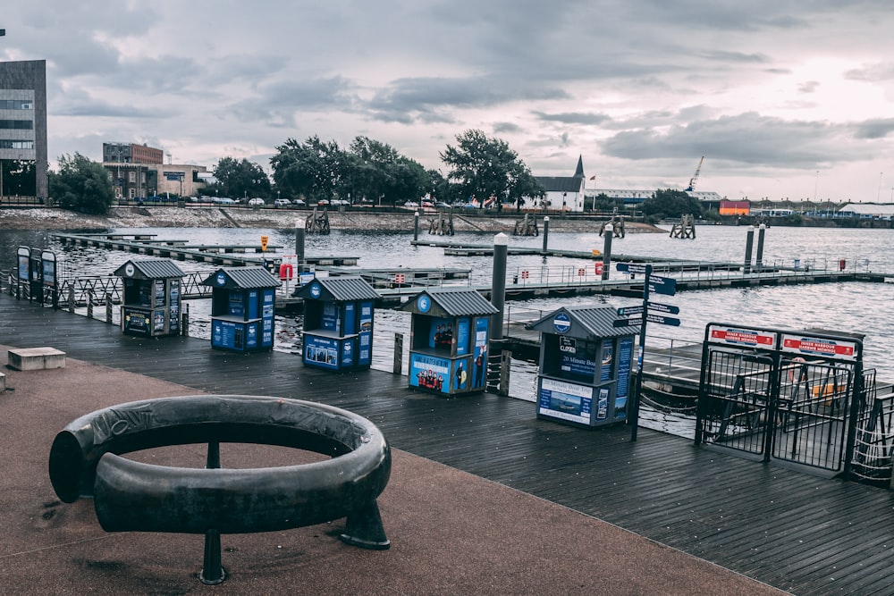 a group of blue and white bins on a dock