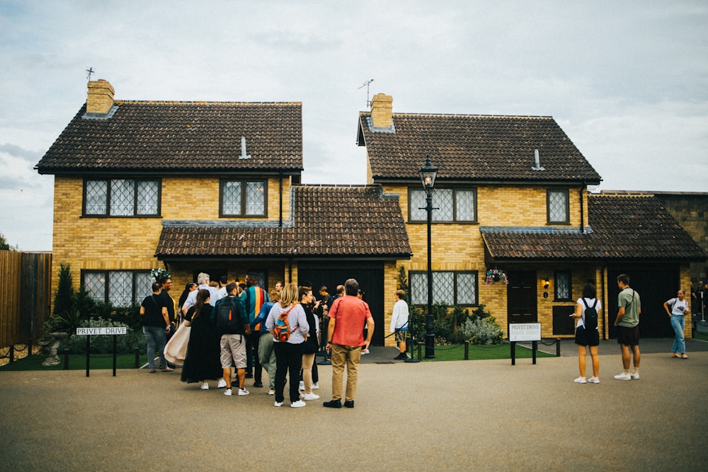 a group of people standing outside a building