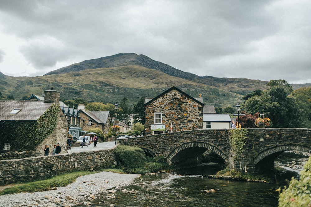 a stone bridge over a river