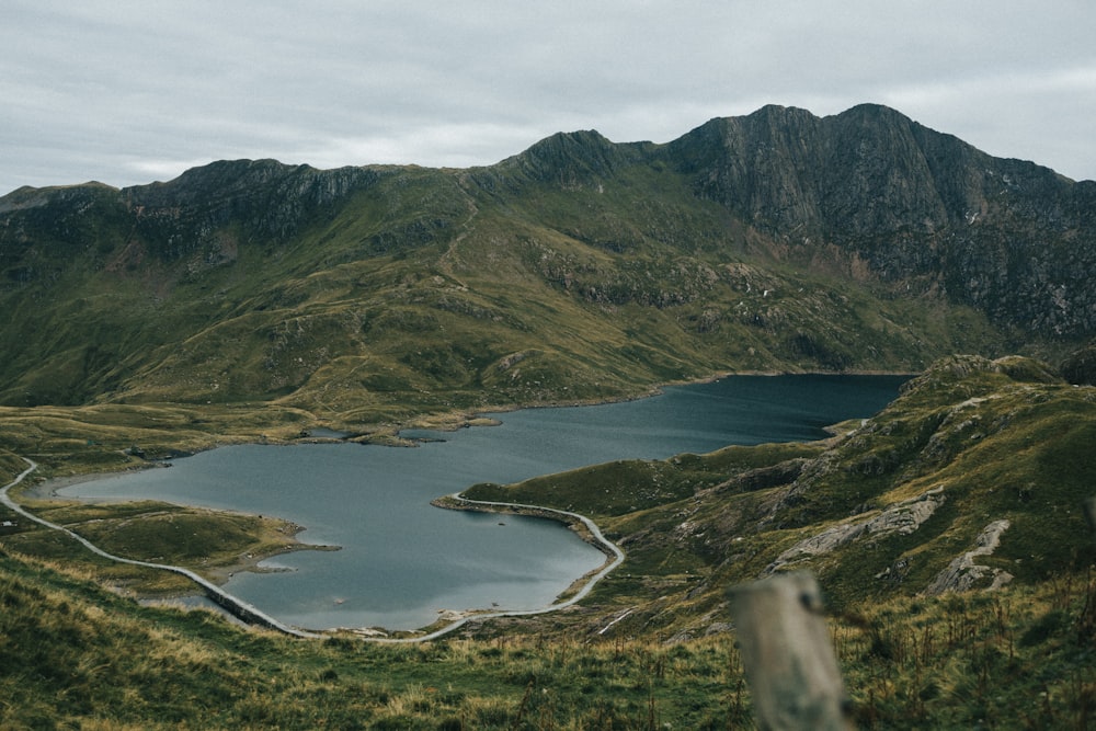 a body of water surrounded by mountains