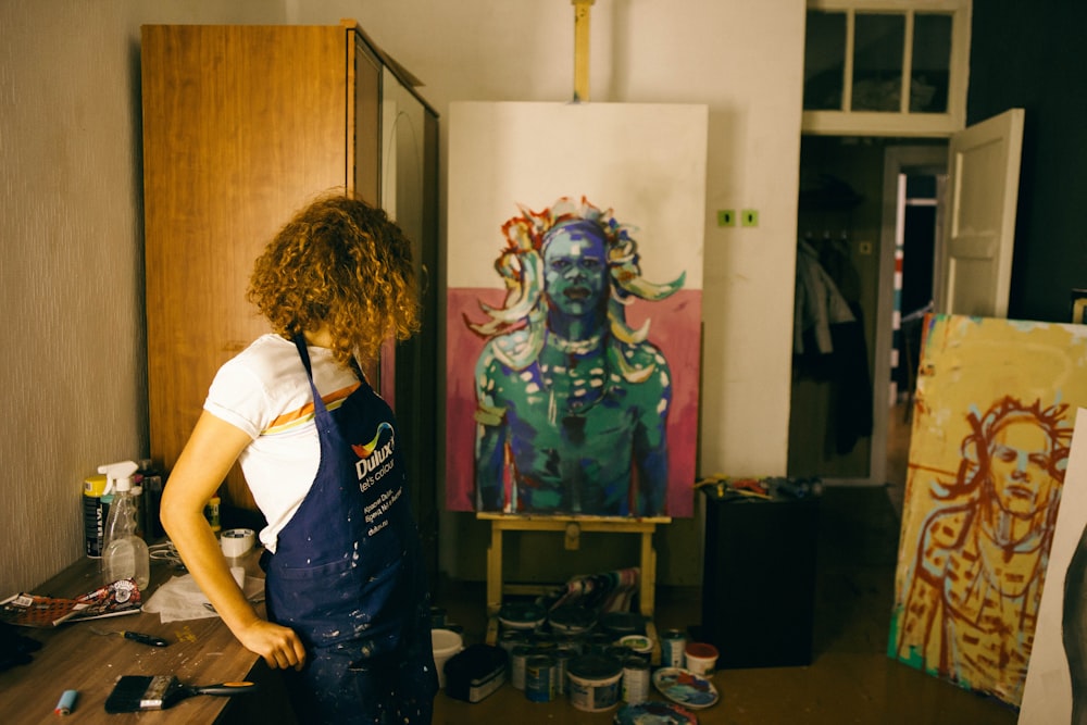 a person painting in a room