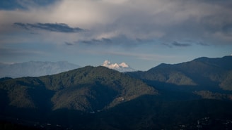 a mountain range with clouds