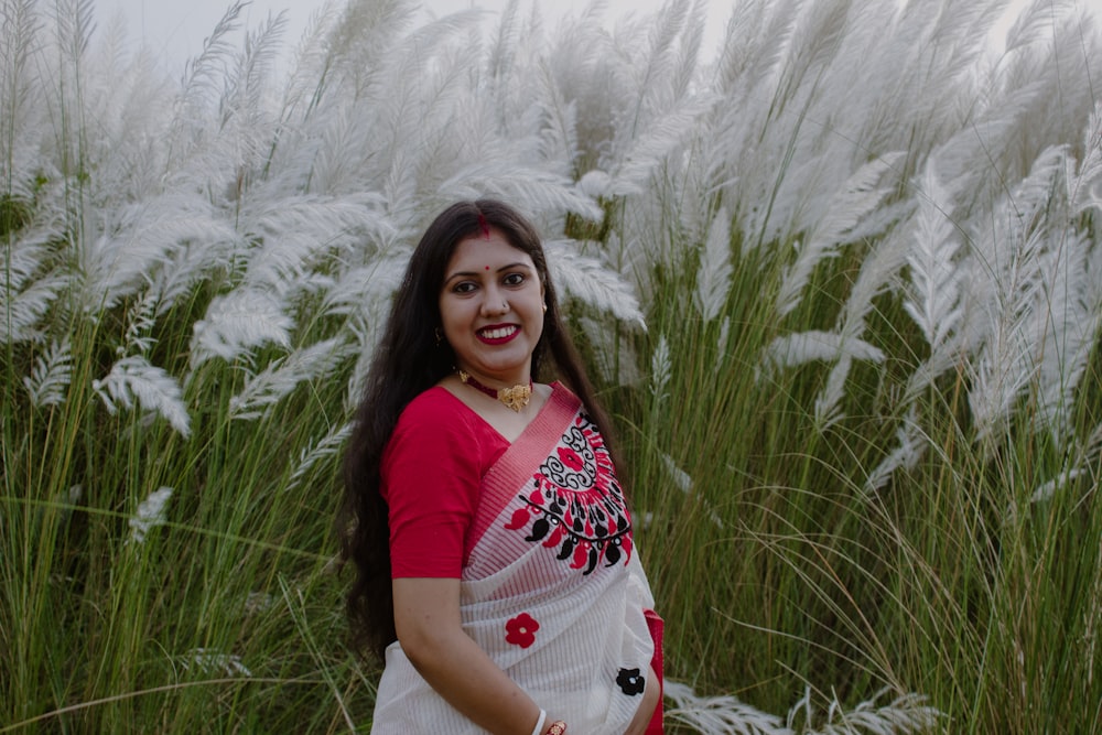 a person standing in a field of tall grass