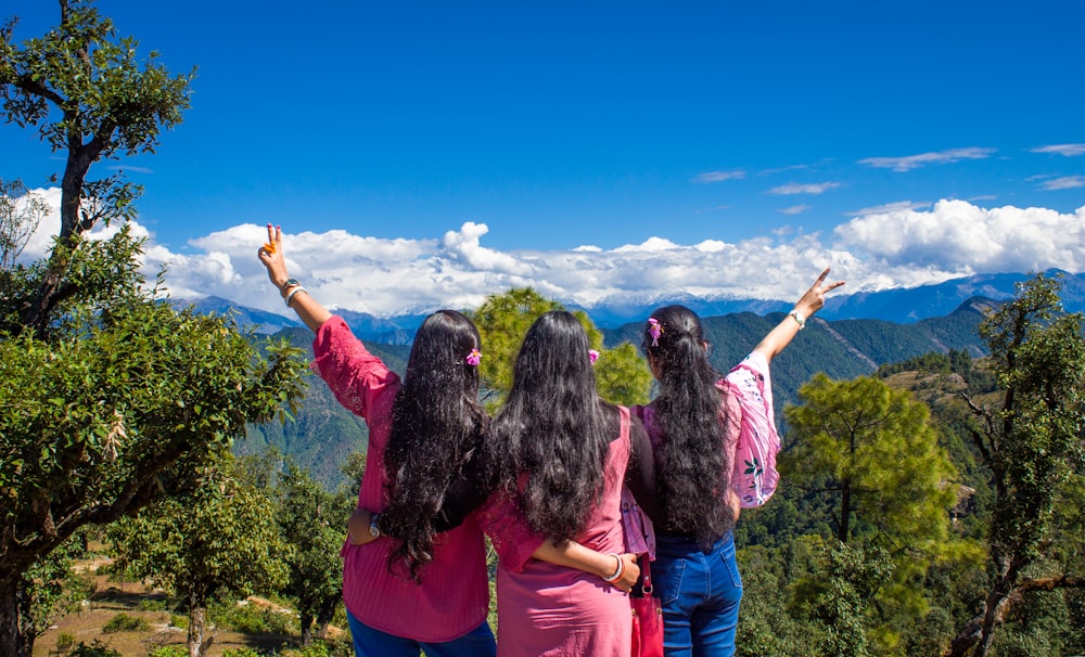 a group of women raising their hands