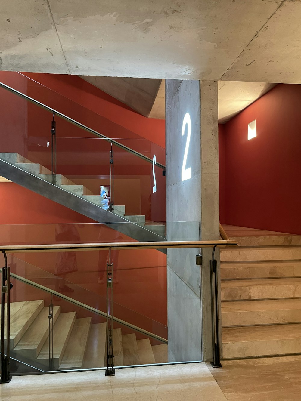 a staircase with red walls