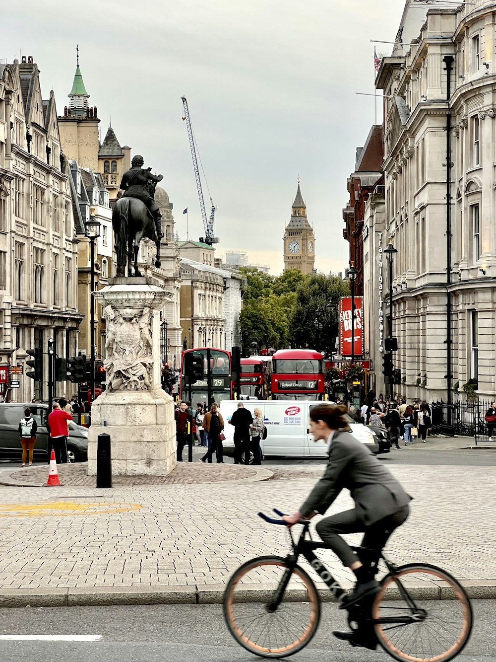 a person riding a bicycle in a city
