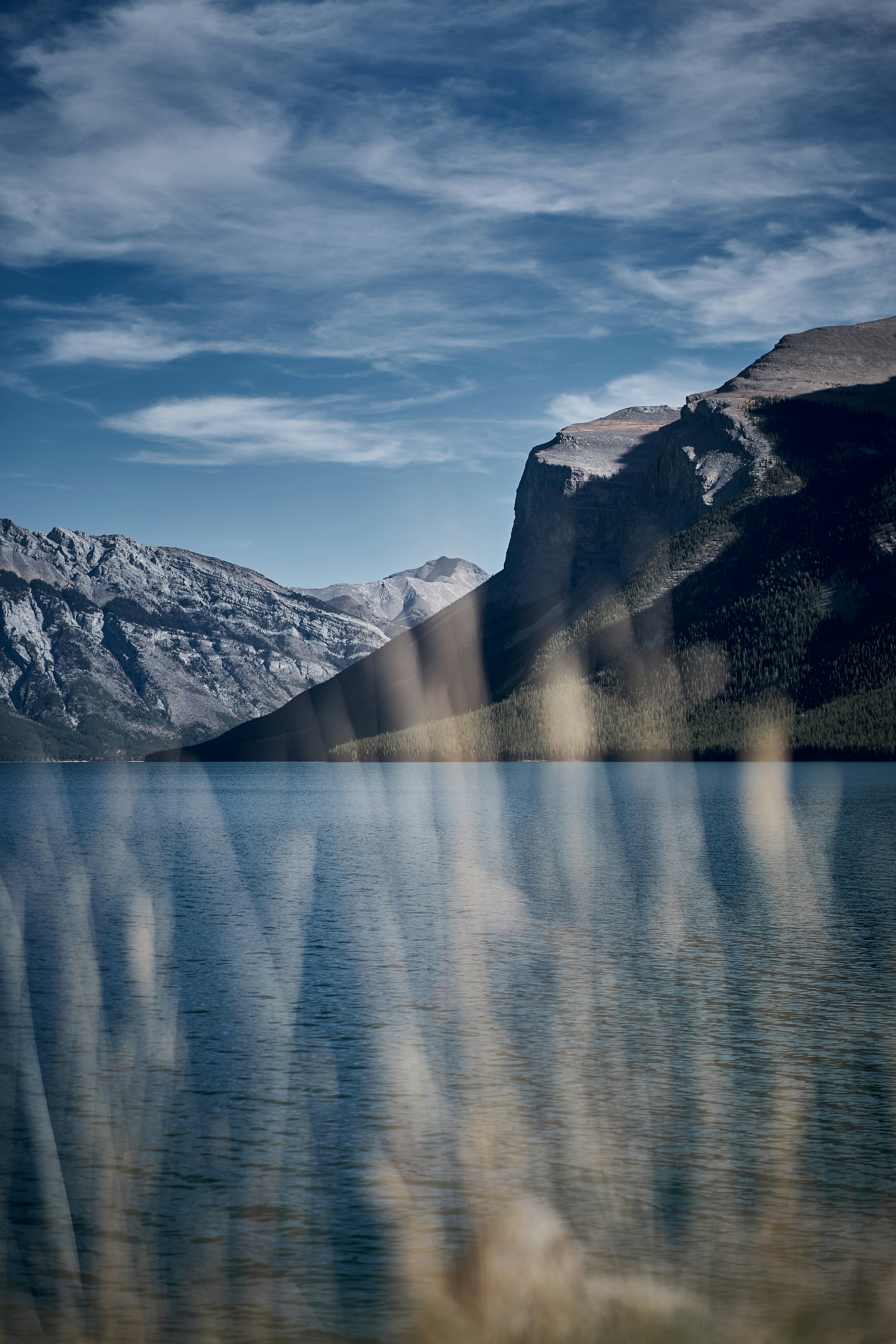 a body of water with mountains in the background