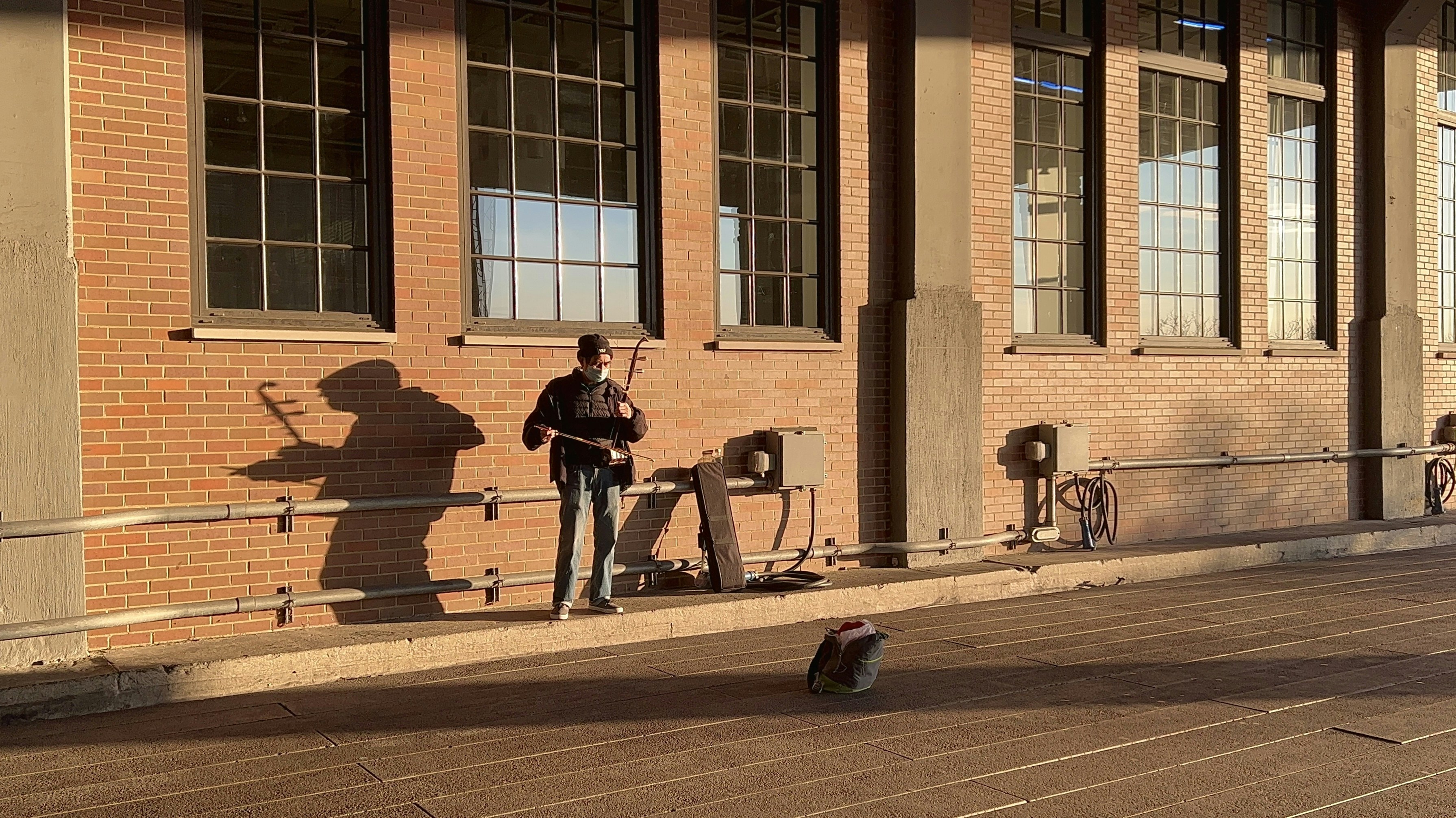 a person standing on a sidewalk
