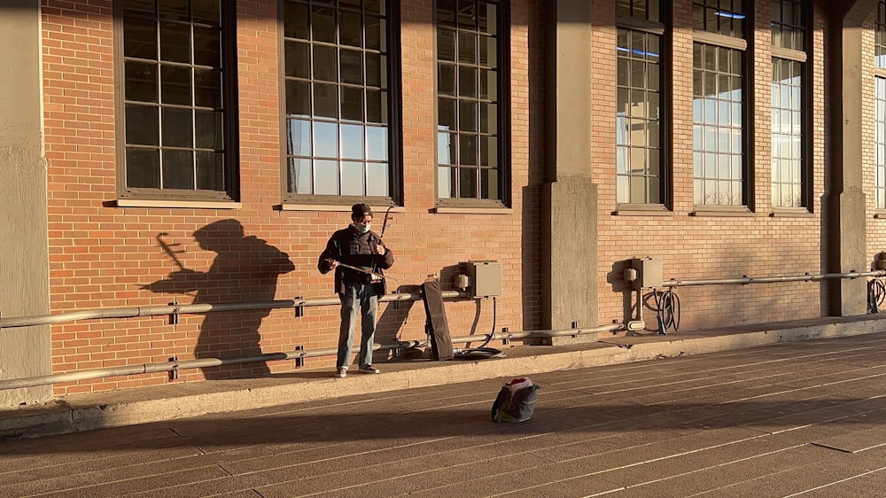 a person standing on a sidewalk