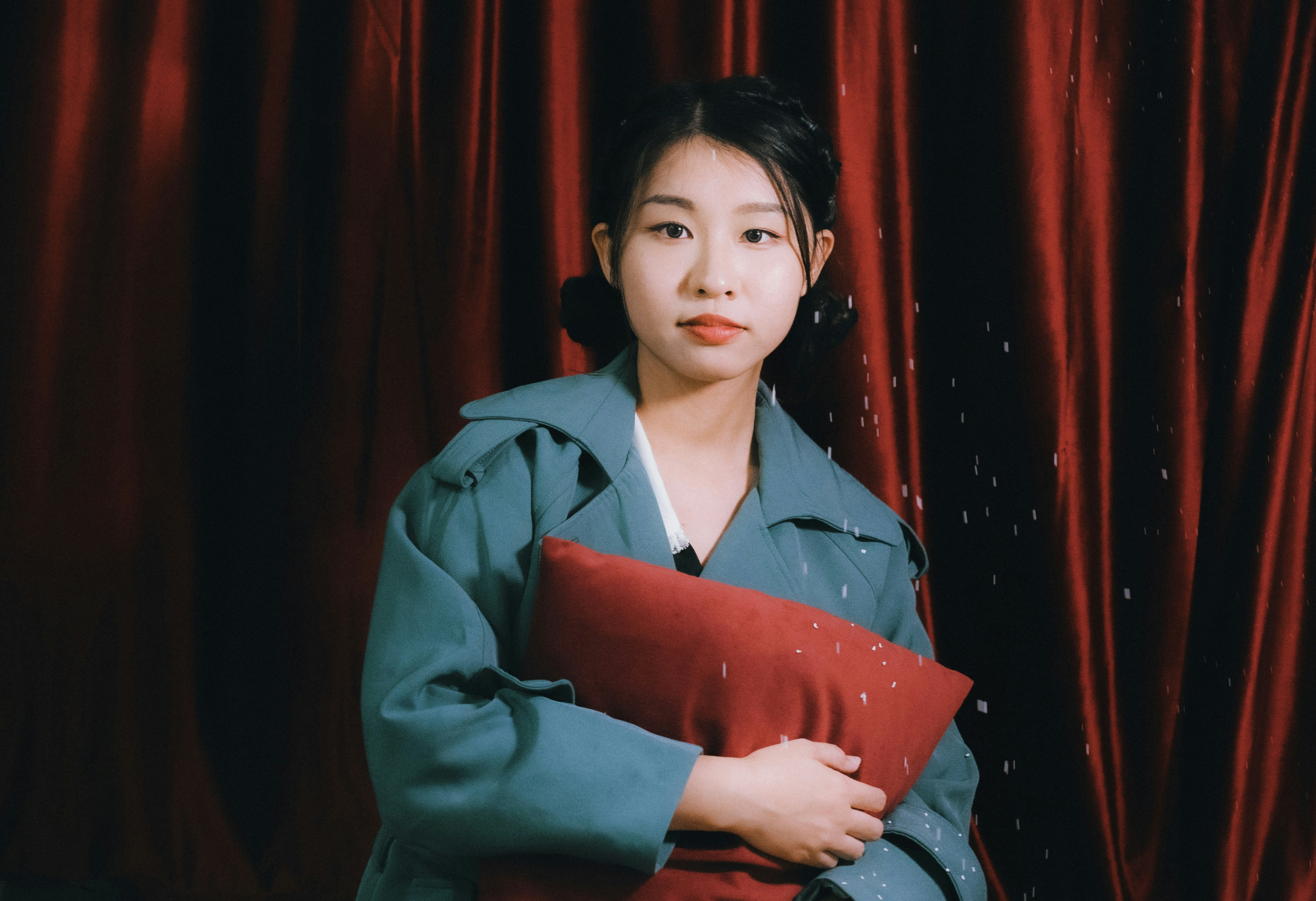 a person holding a red folder