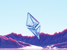 Two transparent, geometric crystals float above a surreal landscape with glowing, purple mountains and a reflective water surface. The sky is light blue, dotted with small glowing stars, creating a dreamlike and futuristic atmosphere.