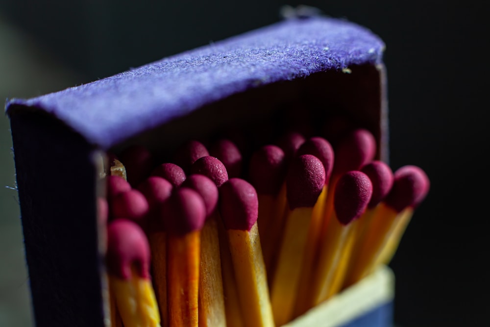 a group of colored pencils