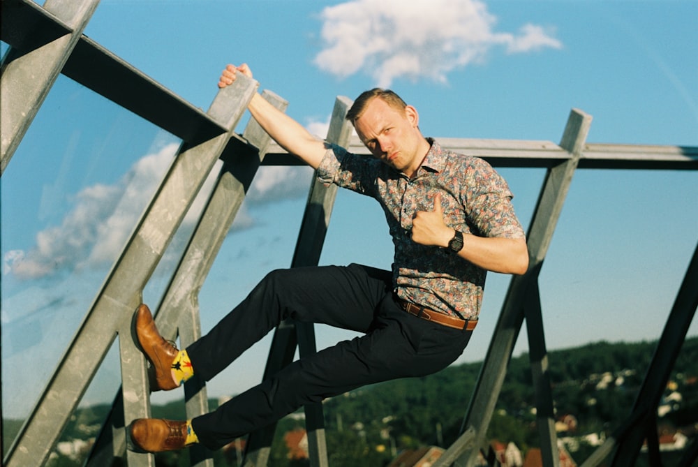 a man sitting on a metal structure