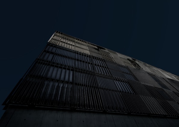 a tall building with a dark sky