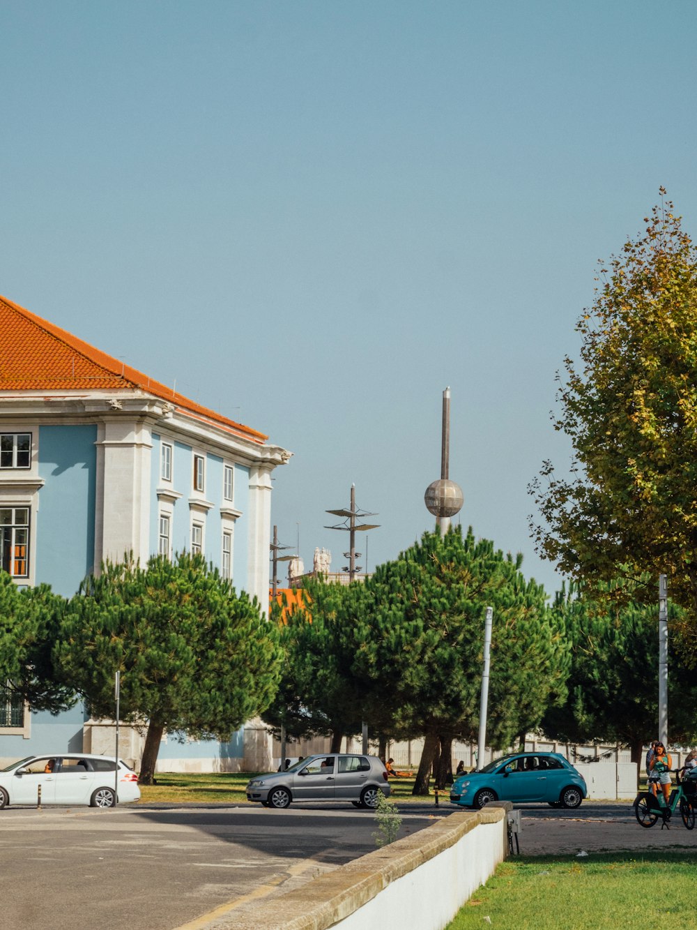 a street with cars and trees