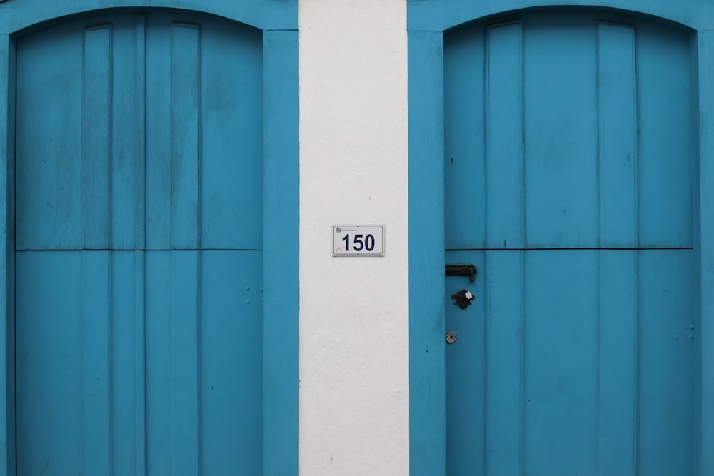 a couple of doors with a sign on the door