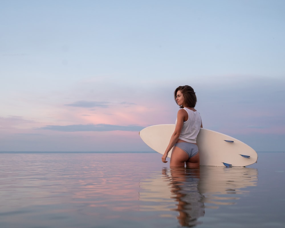 a person holding a surfboard
