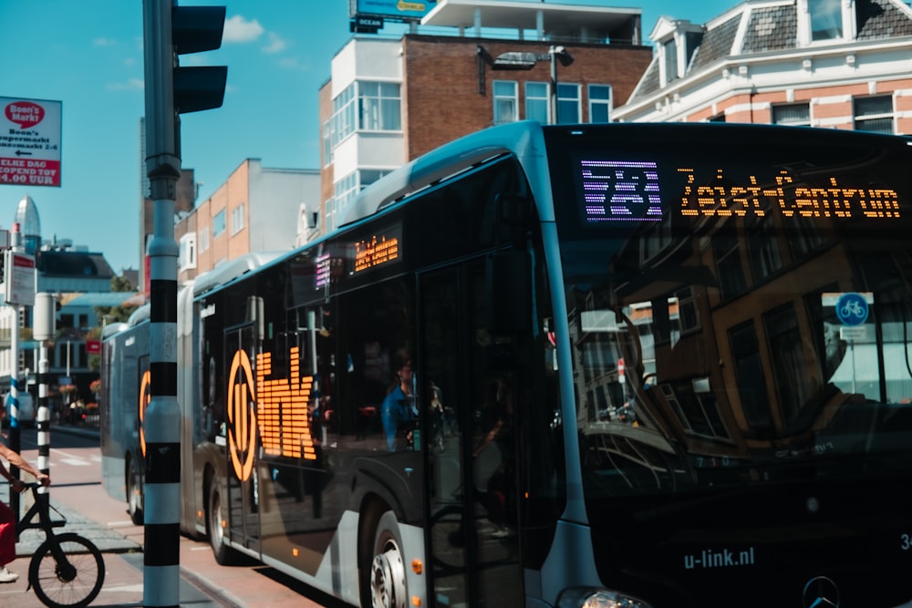 a couple of buses parked on the side of a street