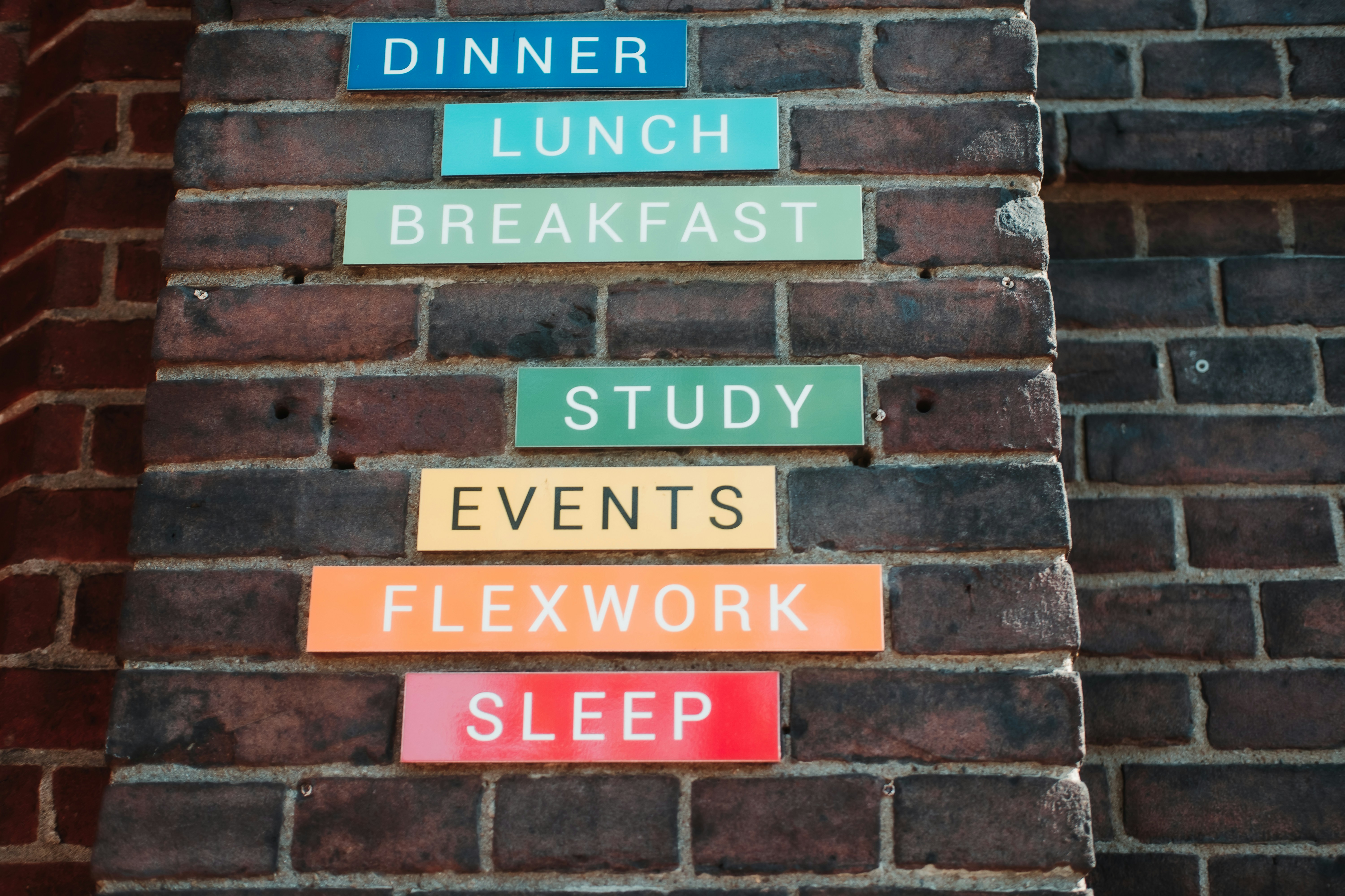 a brick wall with signs on it