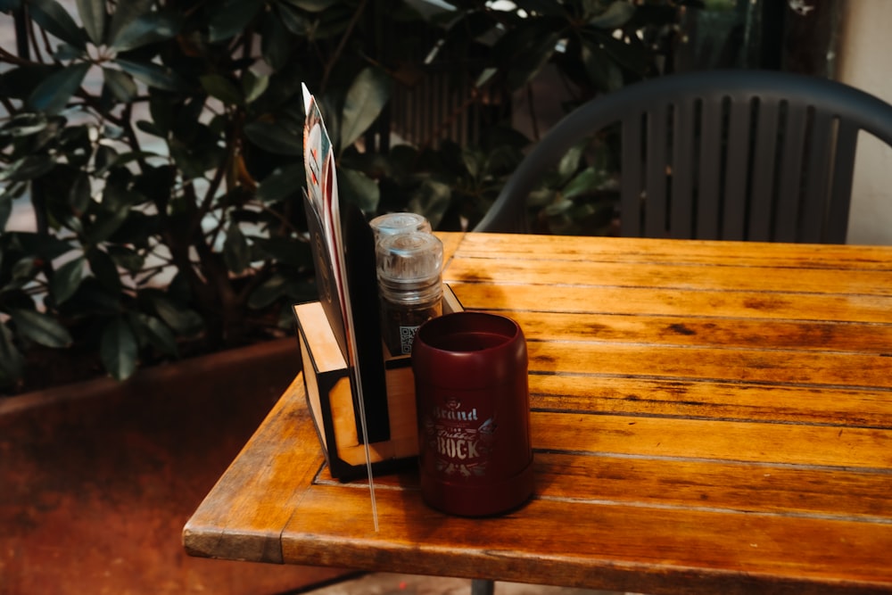 a table with a drink and a bottle of liquor on it