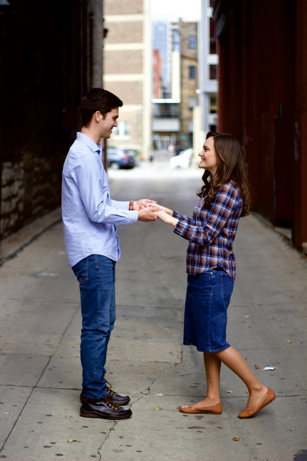 a man and a woman holding hands