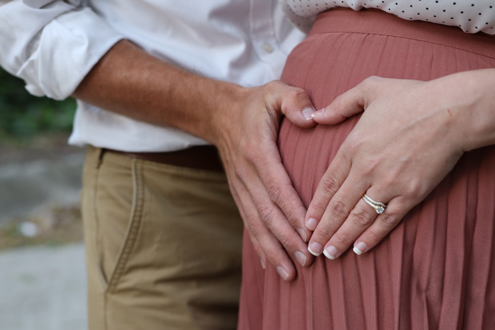 a man and woman holding hands