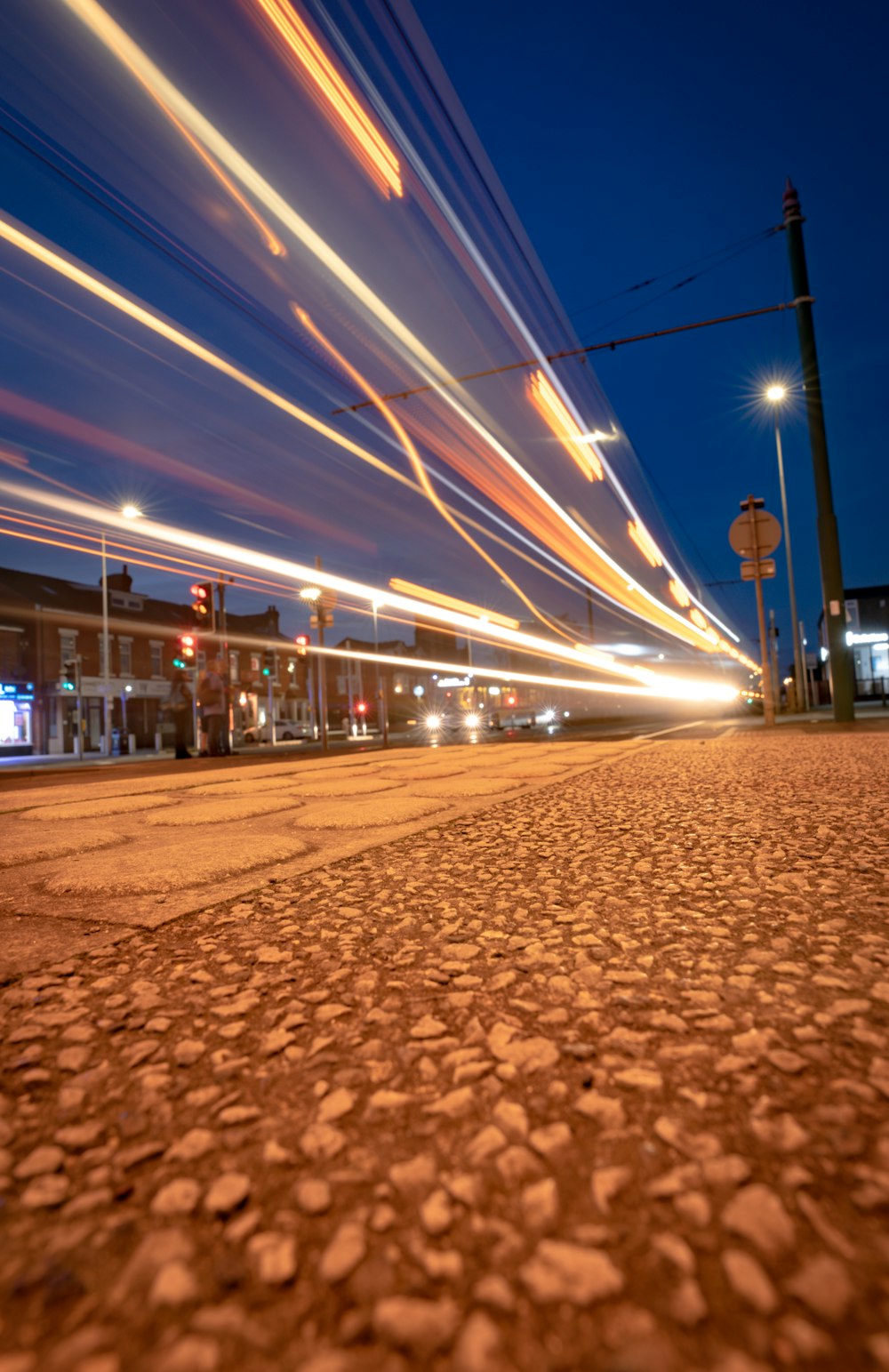 a street with a building and lights