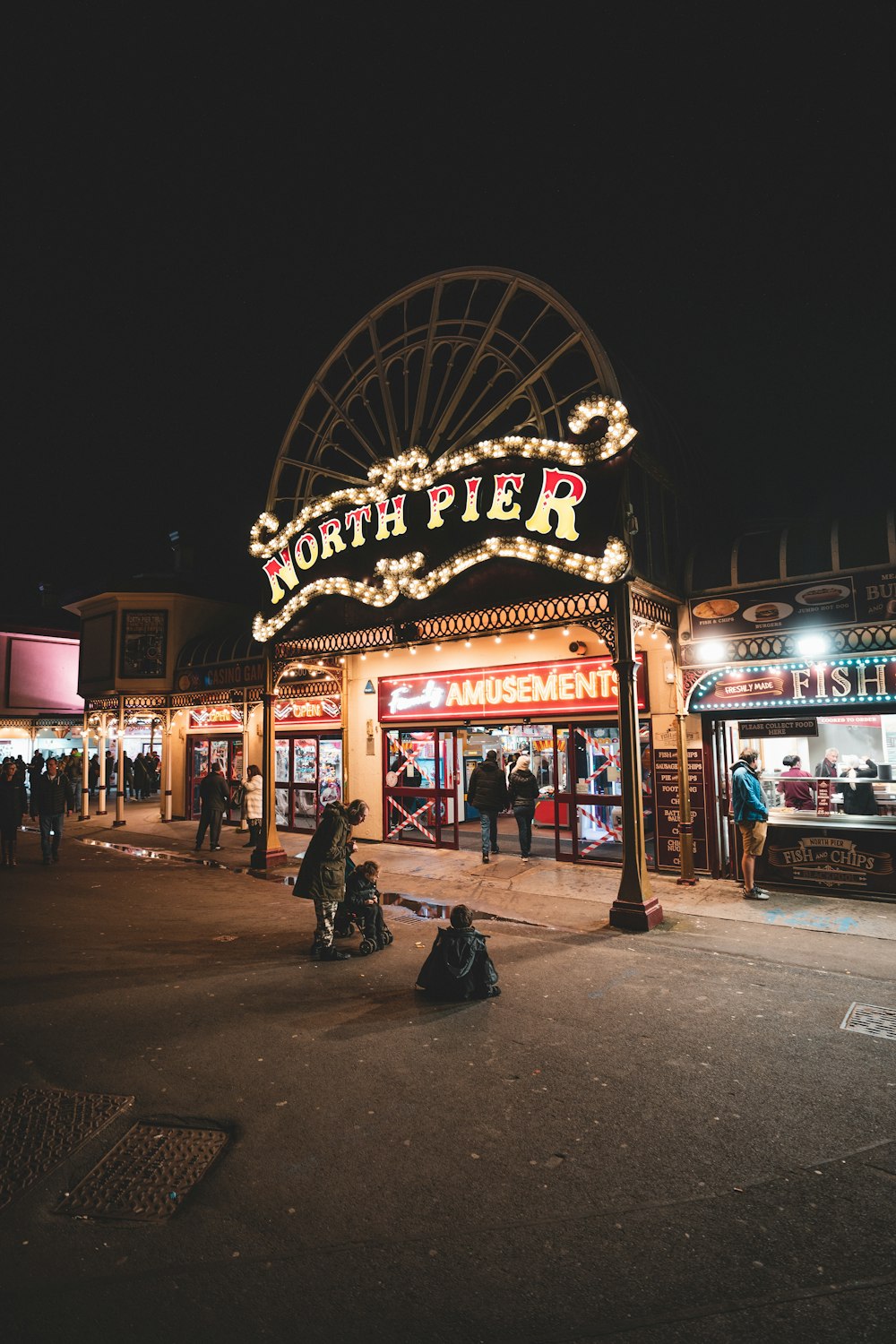 a large sign with lights at night