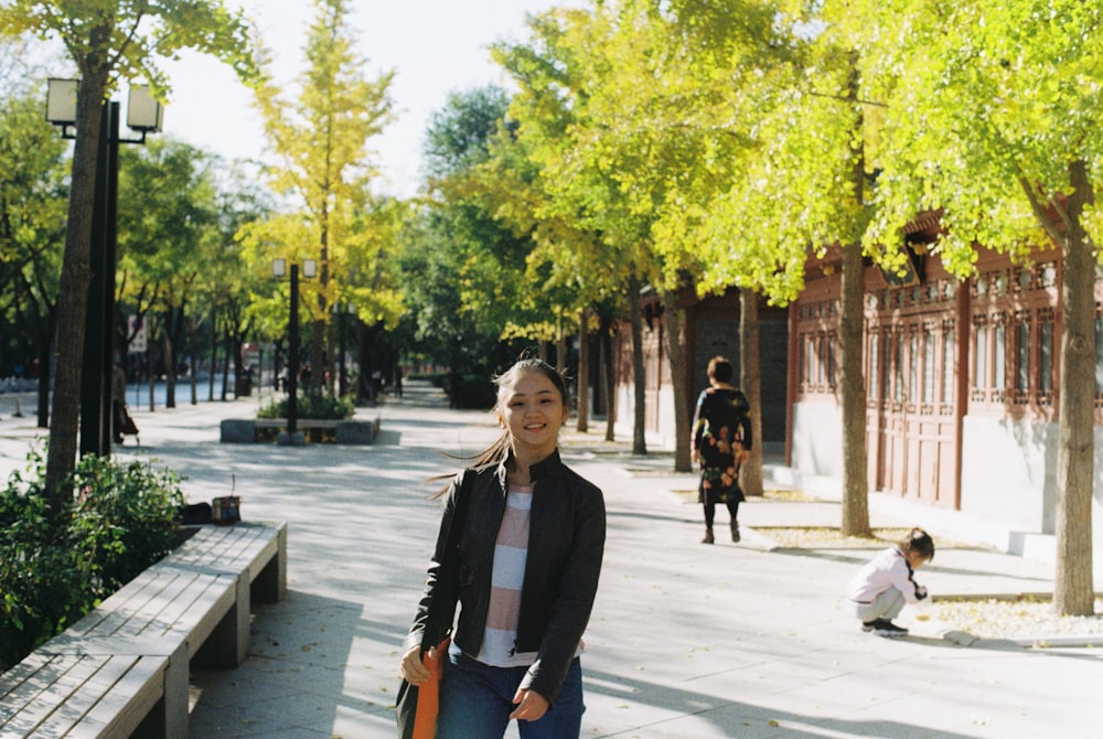 a person standing on a sidewalk