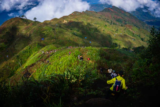 a group of people hiking up a mountain