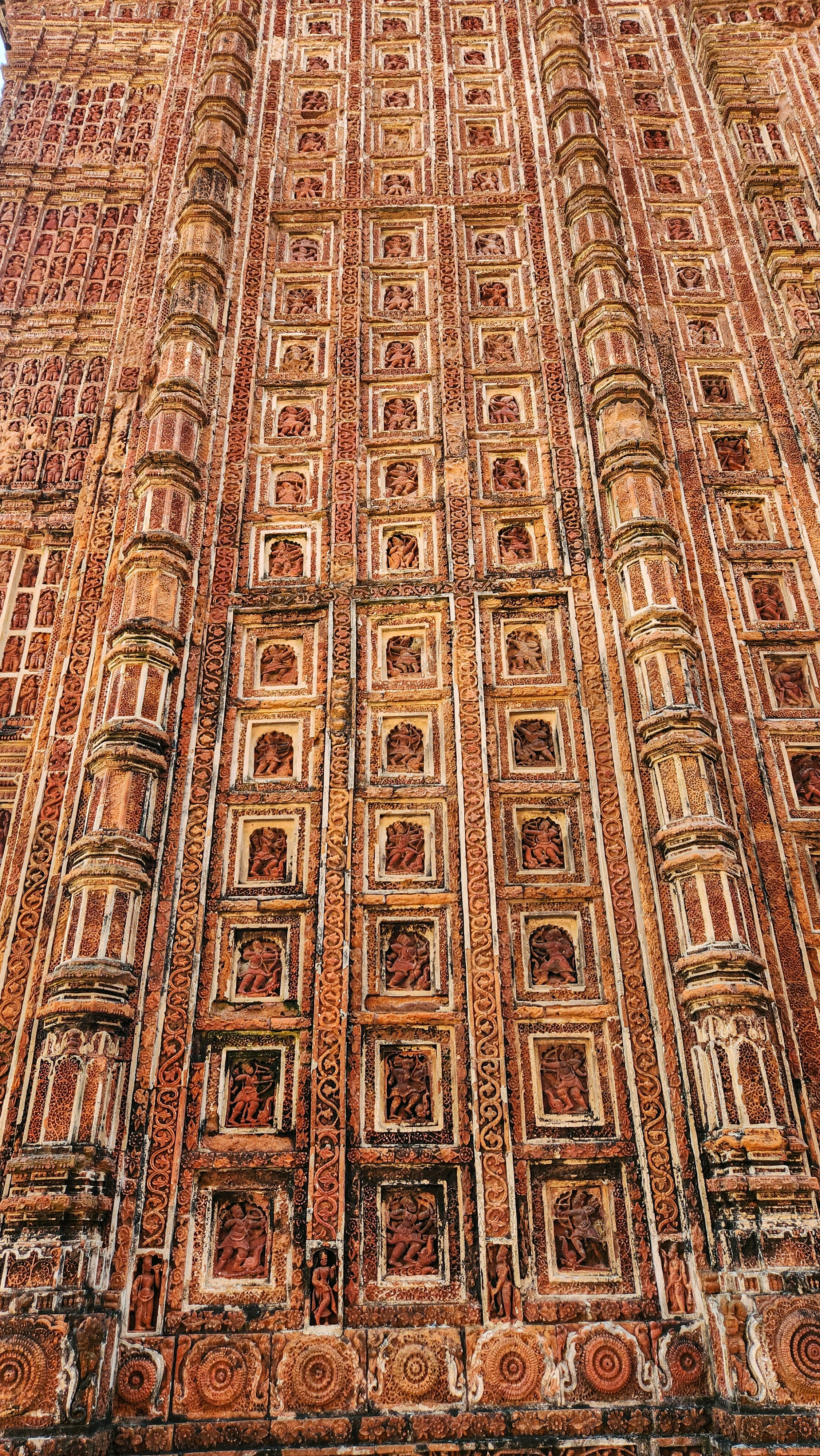 Bishnupur terracotta temple with intricate carvings and red brick architecture