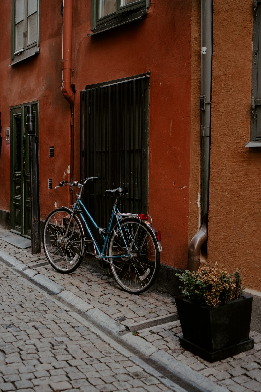 a bicycle parked on a sidewalk