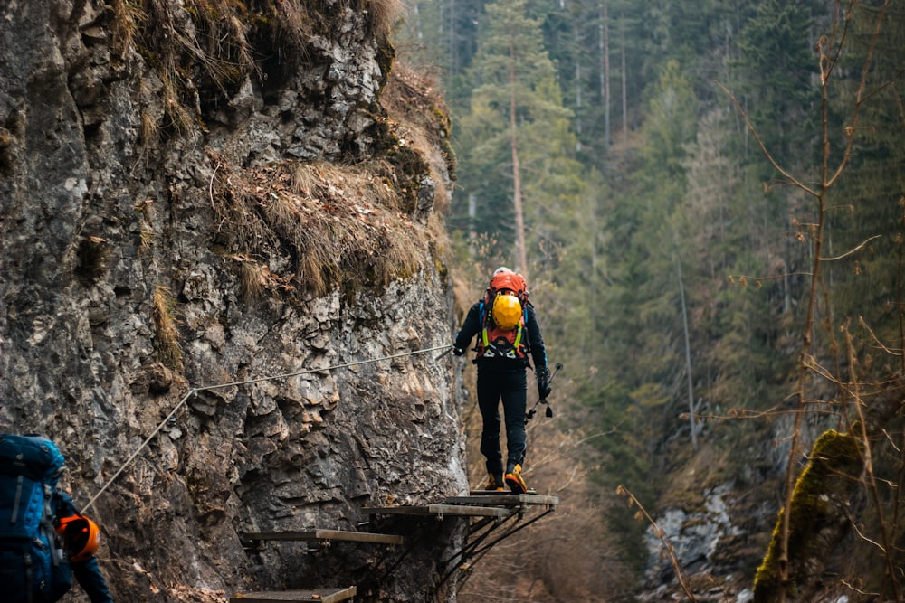 a person climbing a rock