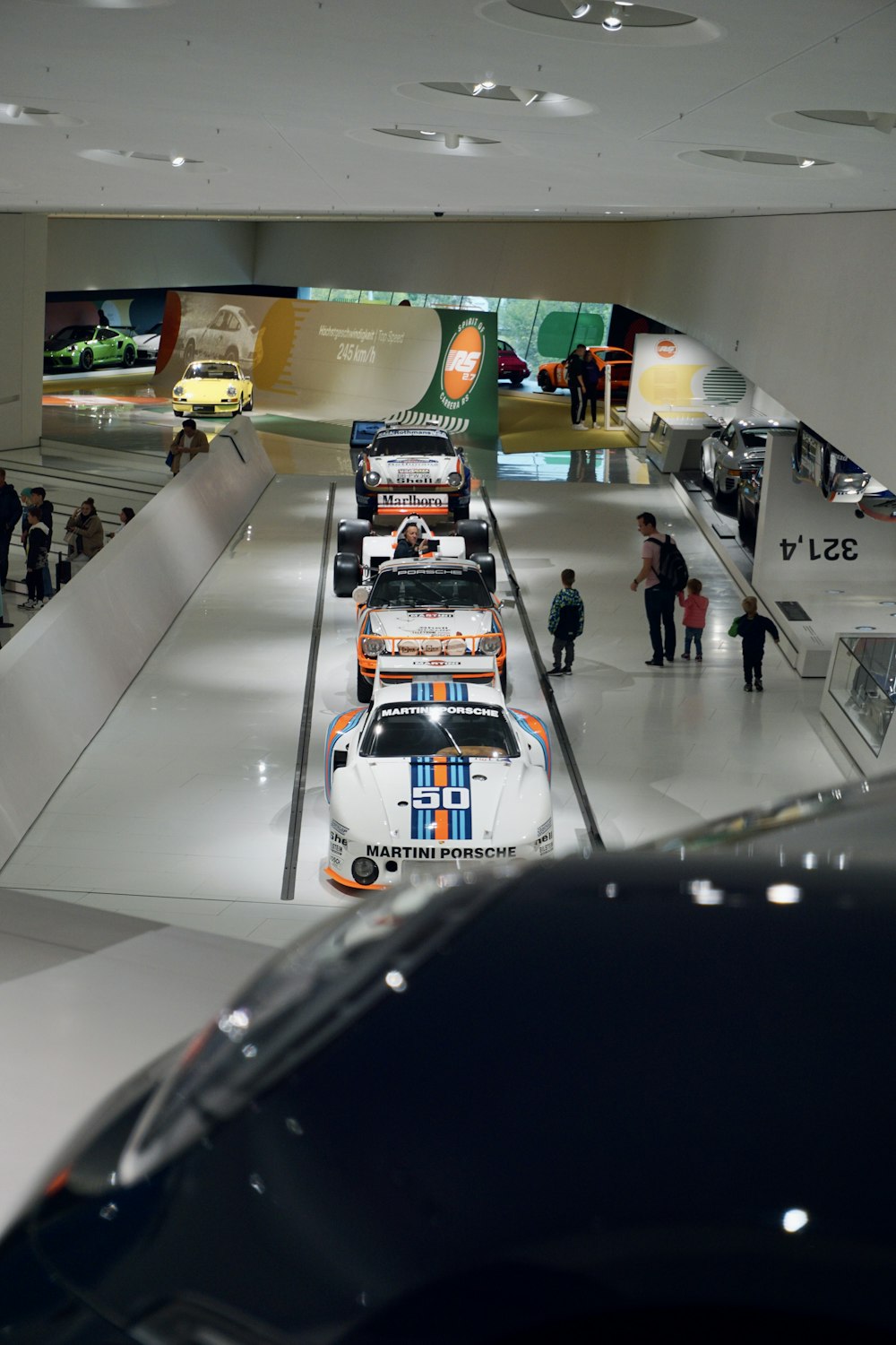 a group of race cars in a showroom