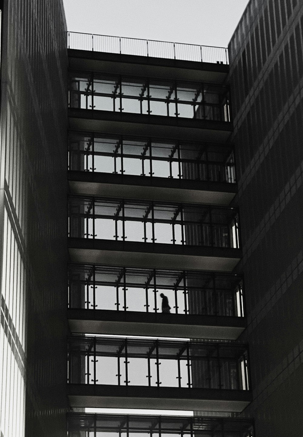 a person sitting on a balcony