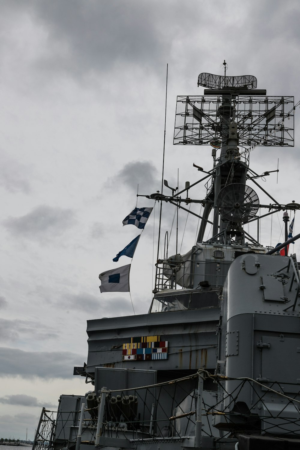 a large ship with flags on it