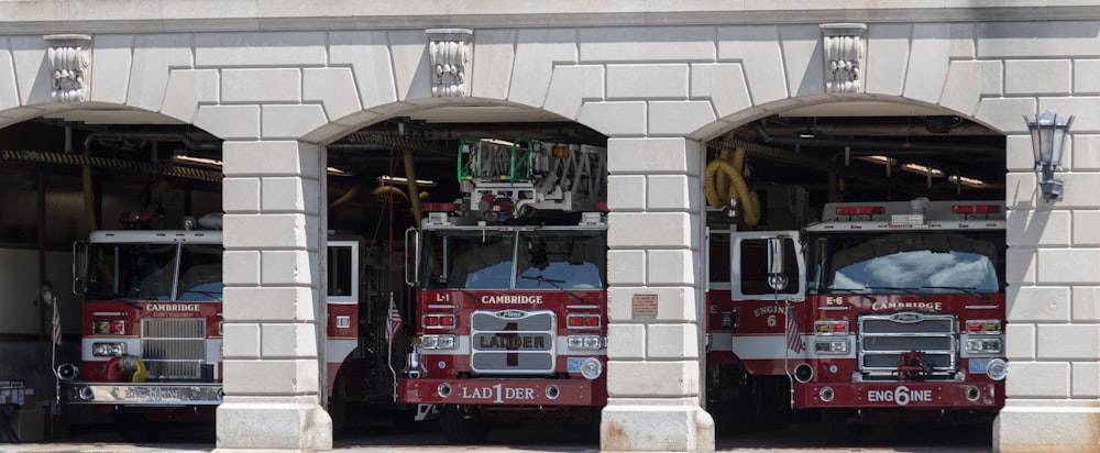 a group of fire trucks in a garage