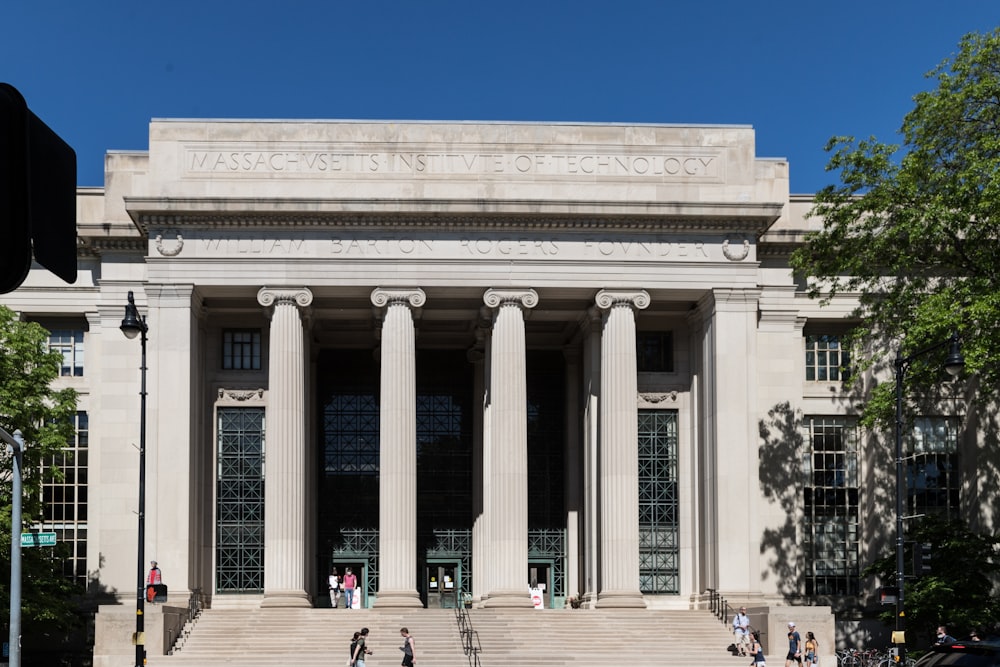 a large white building with columns with Pushkin Museum in the background