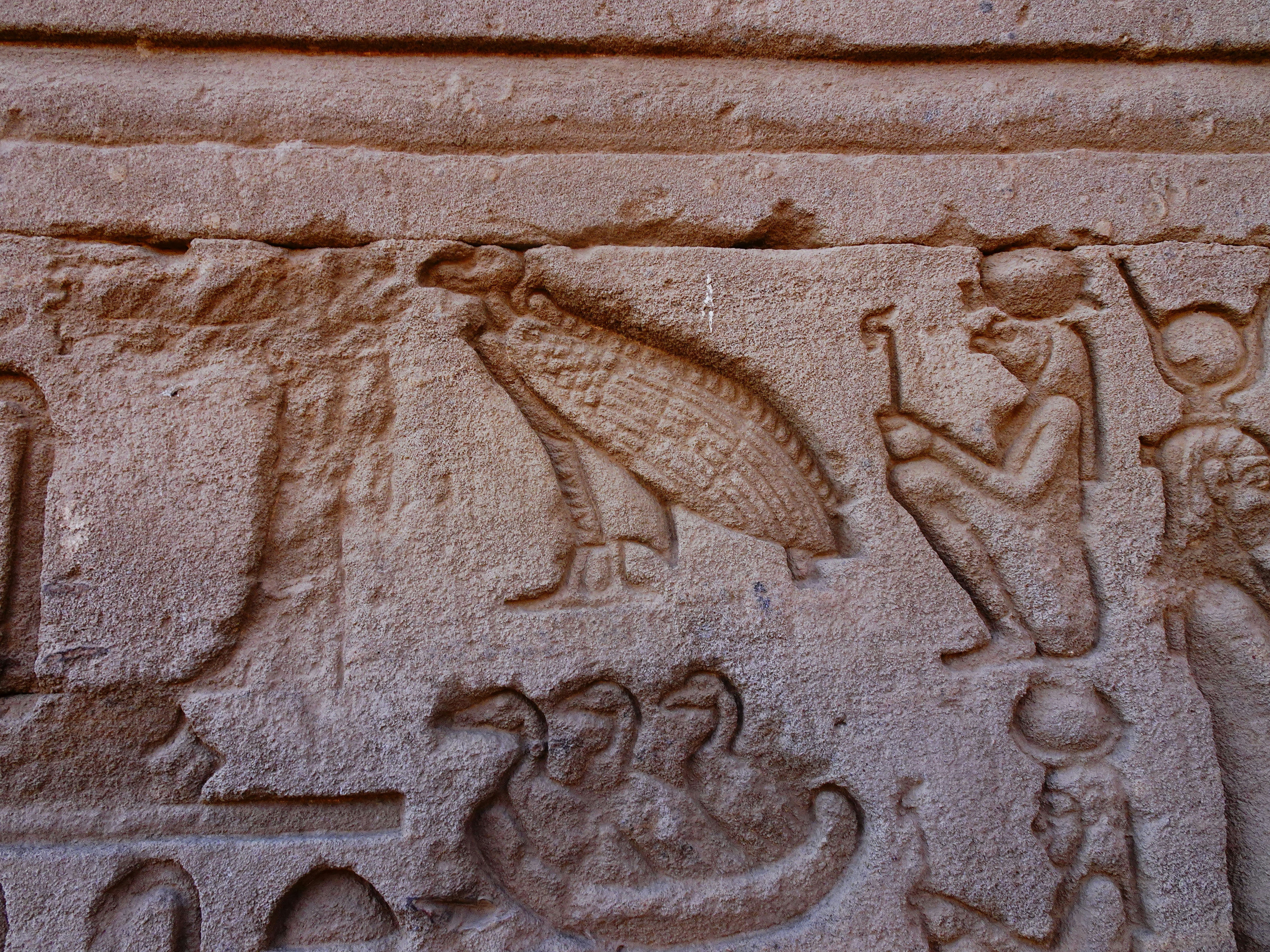 A stone wall with carvings