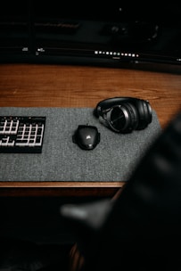 a black headphones on a black surface