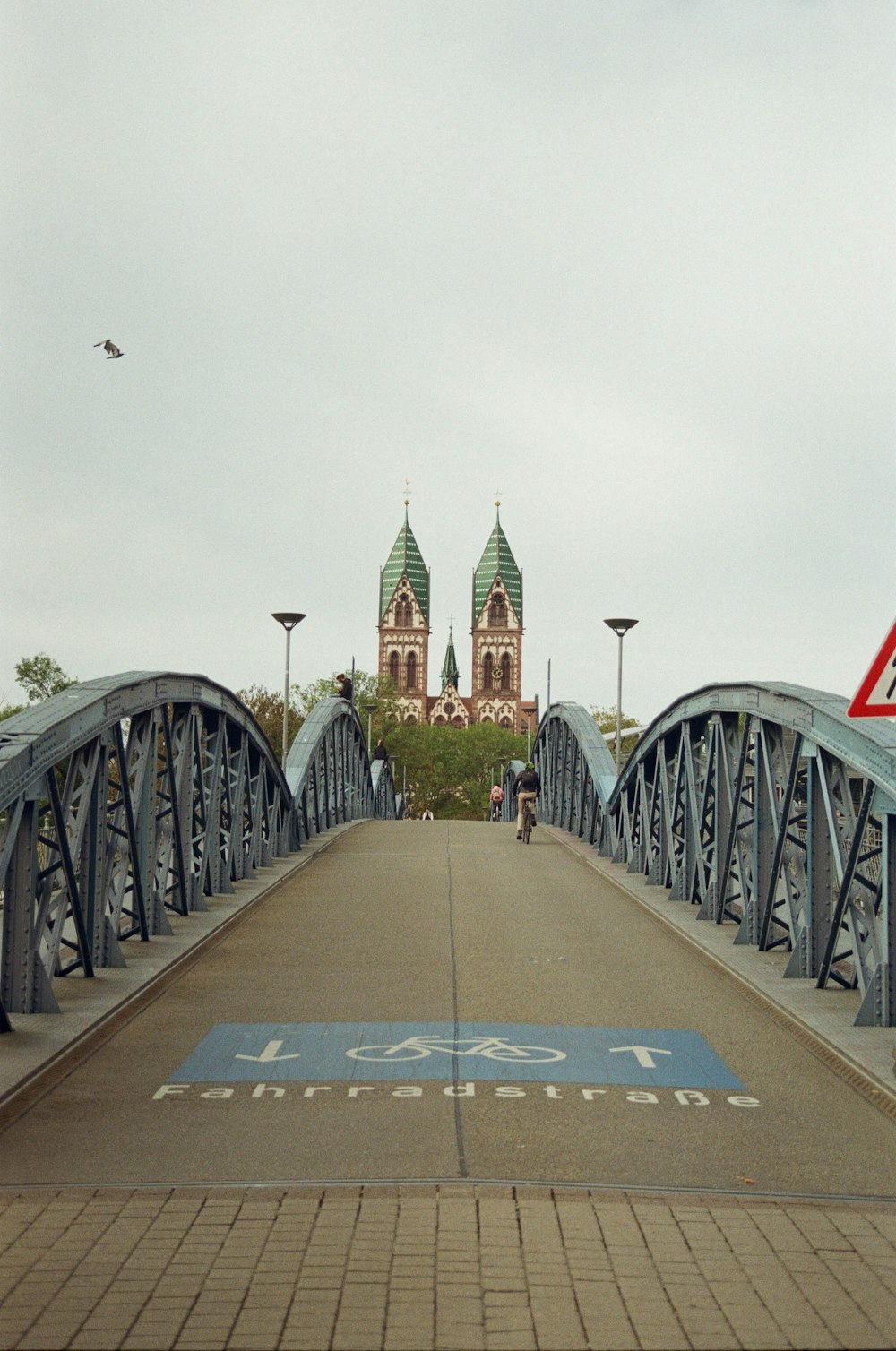 a bridge with a building in the background