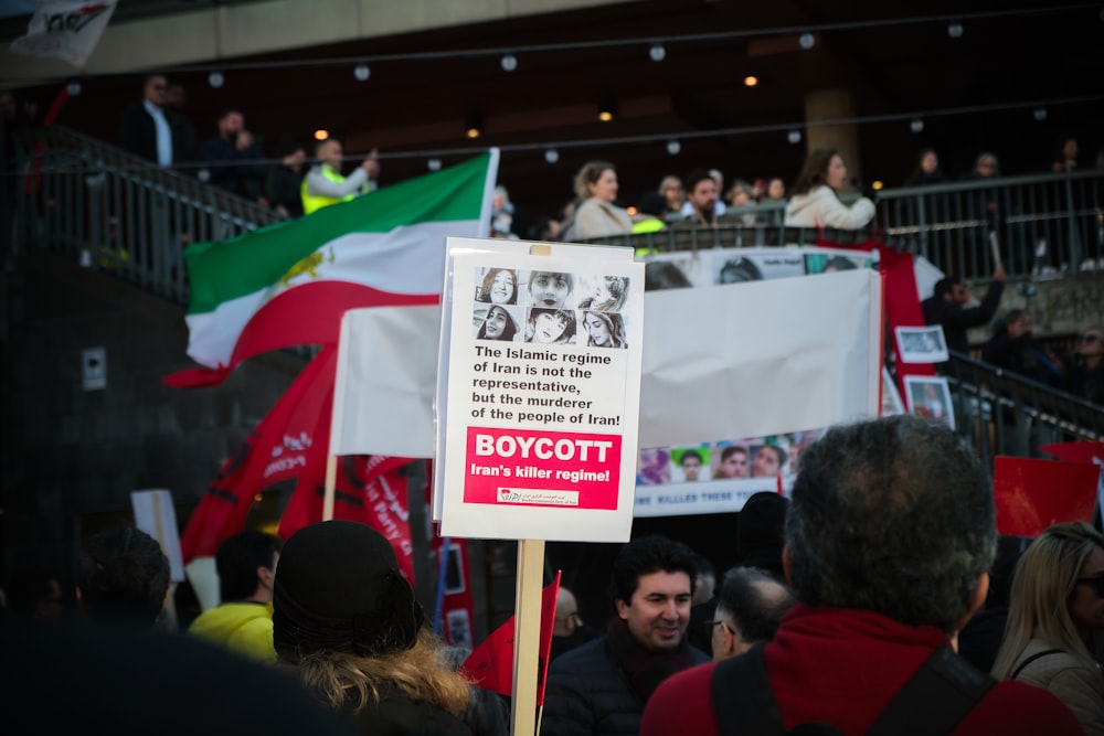 a group of people holding signs