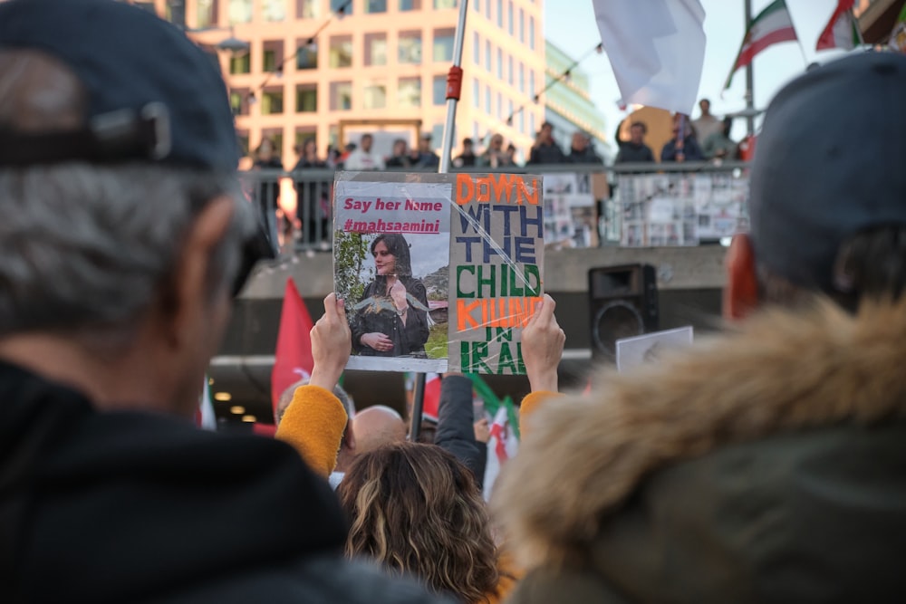 a group of people holding signs