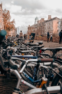 a group of bicycles parked on a sidewalk