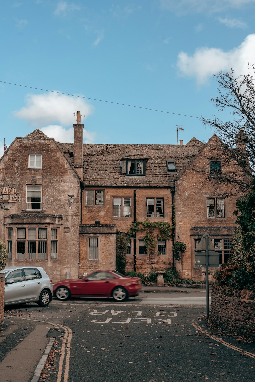 a brick building with cars parked in front of it